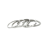 The Vigorous Stack, a five-piece silver bangle set featuring various styles with cubic zirconia accents.