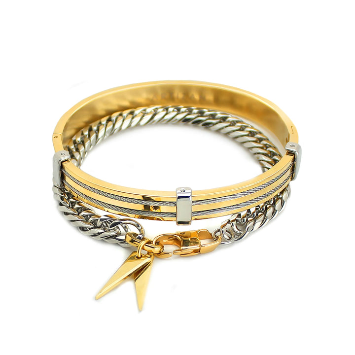 The Iron Stack, a two-piece gold and silver bracelet stack featuring a gold bangle with textured detailing and a silver chain bracelet with a geometric charm.