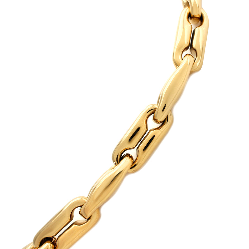 The MERGED BRACELET which is made of 18k gold plated stainless steel. It comes with large individual chains and has a total length of 7.5 inches.
