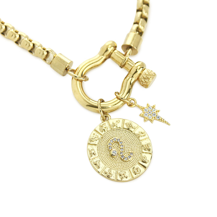 The Leo Herradura Zodiac Necklace which is made of 18” Hypoallergenic Gold Plated Stainless Steel chain with 18K Gold Plated Horseshoe clasp and miniature star pendant and circular star sign micro pave Leo constellation charm. ||| LEO/GOLD