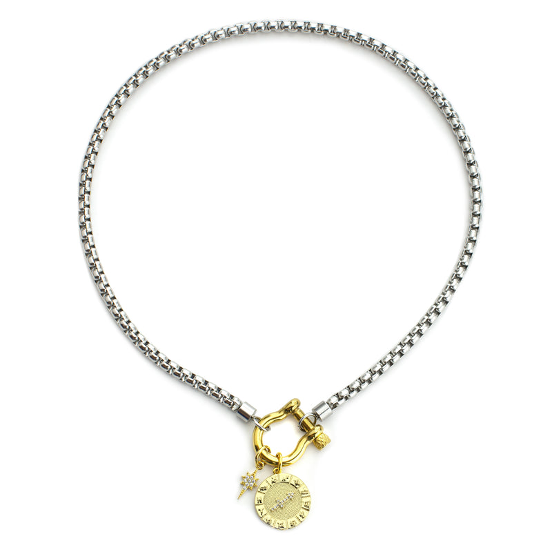 The Sagittarius Herradura Zodiac Necklace which is made of 18” Hypoallergenic Rhodium Plated Stainless Steel chain with 18K Gold Plated Horseshoe clasp and miniature star pendant and circular star sign micro pave Sagittarius constellation charm.