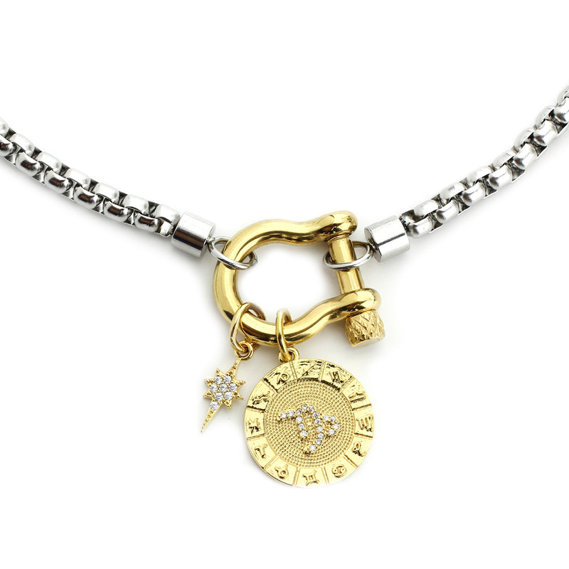 The Capricorn Herradura Zodiac Necklace which is made of 18” Hypoallergenic Rhodium Plated Stainless Steel chain with 18K Gold Plated Horseshoe clasp and miniature star pendant and circular star sign micro pave Capricorn constellation charm.