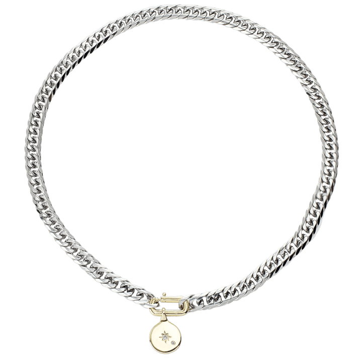 The SLIM CHARM NECKLACE which is a 16" Stainless steel chain with 24k gold filled north star pendant and gold filled oval clasp.