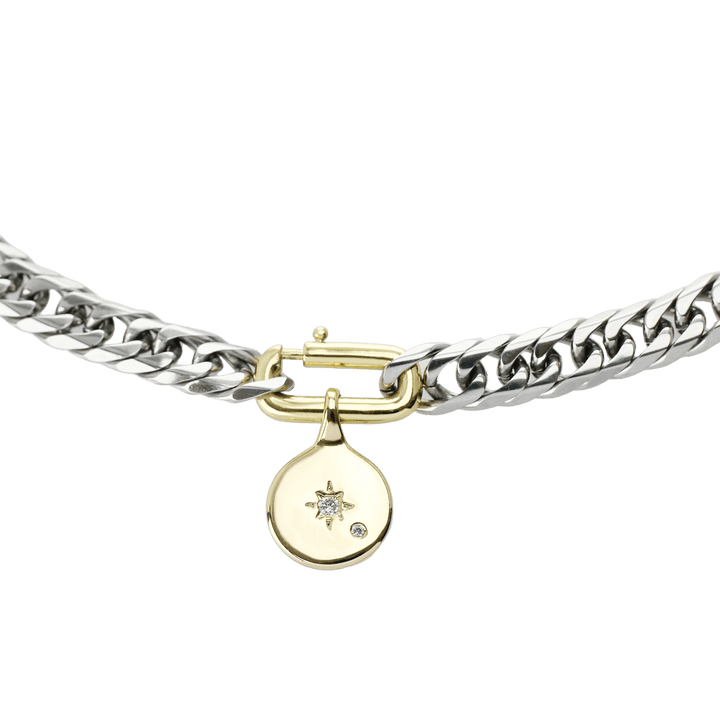 The SLIM CHARM NECKLACE which is a 16" Stainless steel chain with 24k gold filled north star pendant and gold filled oval clasp.