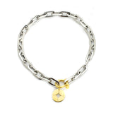 The Herradura Puerto Necklace, a silver necklace with a gold compass charm and a unique clasp.