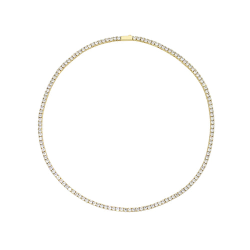 The Gold Tennis Necklace, a single gold necklace adorned with a continuous line of sparkling round crystals. This classic and elegant piece adds a refined shimmer, perfect for elevating any outfit with its timeless tennis chain design.