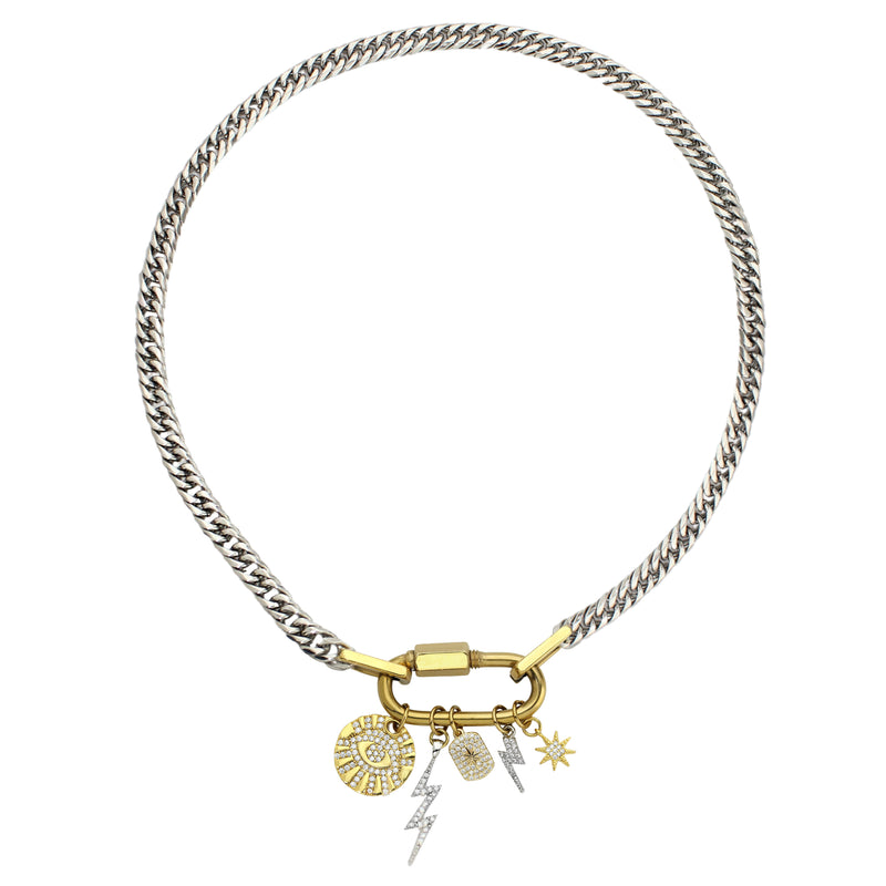 The ANNE CHARM NECKLACE which is an 18", 9mm wide stainless steel chain with an 18K Gold Plated Stainless Steel carabiner clasp strung with dainty gold filled charms, including 2 lightning bolts, evil eye, celestial tag star and a star.