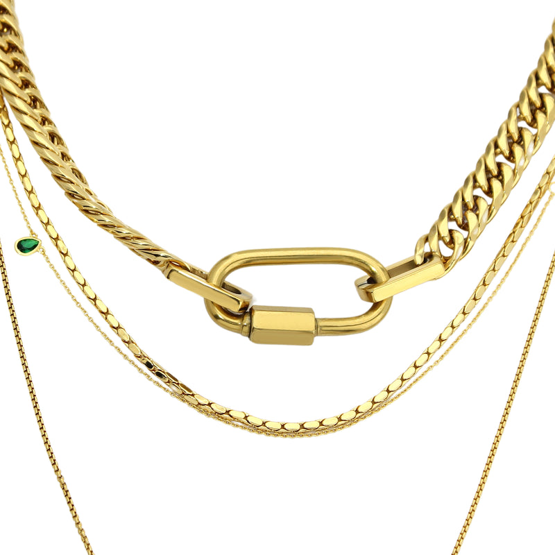 The ANNE GOLD NECKLACE SET which includes 4 separate layered chains. The shortest is the Anne Necklace made of chunky 18k gold plated stainless steel chain with carabiner clasp followed with two thin necklaces that are 20" and 24" in length and a necklace with 925 Sterling Silver Gold plated emerald drop dainty charm.