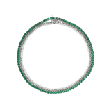 The Emerald Tennis Necklace Set, a three-piece silver necklace set featuring a single strand of emerald green gemstones, a single strand of white cubic zirconia, and a three-row necklace with alternating emerald green gemstones and white cubic zirconia.