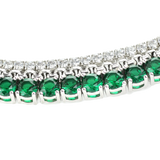 The EMERALD TENNIS NECKLACE SET which includes 3 layered necklaces. A Stainless steel Rhodium plated chain that is 1mm Wide, a 925 sterling silver cubic zirconia tennis necklace - 2 mm wide and Man made emerald rhodium-plated brass/cubic zirconia.