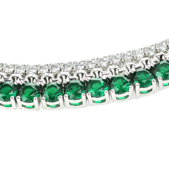 The EMERALD TENNIS NECKLACE SET which includes 3 layered necklaces. A Stainless steel Rhodium plated chain that is 1mm Wide, a 925 sterling silver cubic zirconia tennis necklace - 2 mm wide and Man made emerald rhodium-plated brass/cubic zirconia.