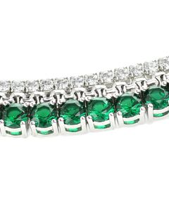 The EMERALD TENNIS NECKLACE SET which includes 3 layered necklaces. A Stainless steel Rhodium plated chain that is 1mm Wide, a 925 sterling silver cubic zirconia tennis necklace - 2 mm wide and Man made emerald rhodium-plated brass/cubic zirconia.