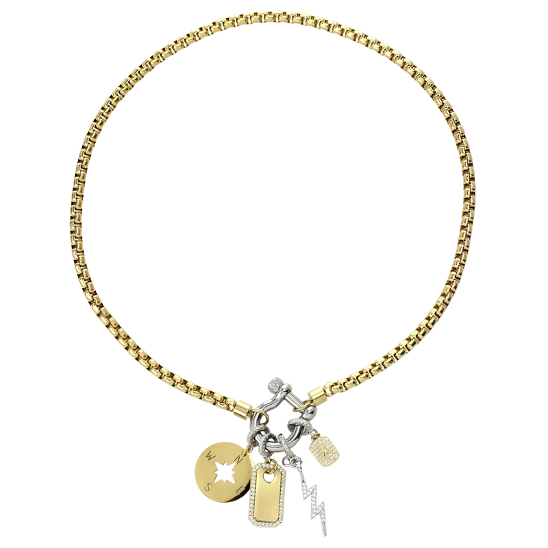 The Herradura Mix Necklace with gold chain and silver clasp. It comes with the celestial star, compass, plaque clip on and the LIGHTNING BOLT CLIP ON CHARM which is made of Pave Clip on Stainless steel 18k gold plated lighting bolt charm.